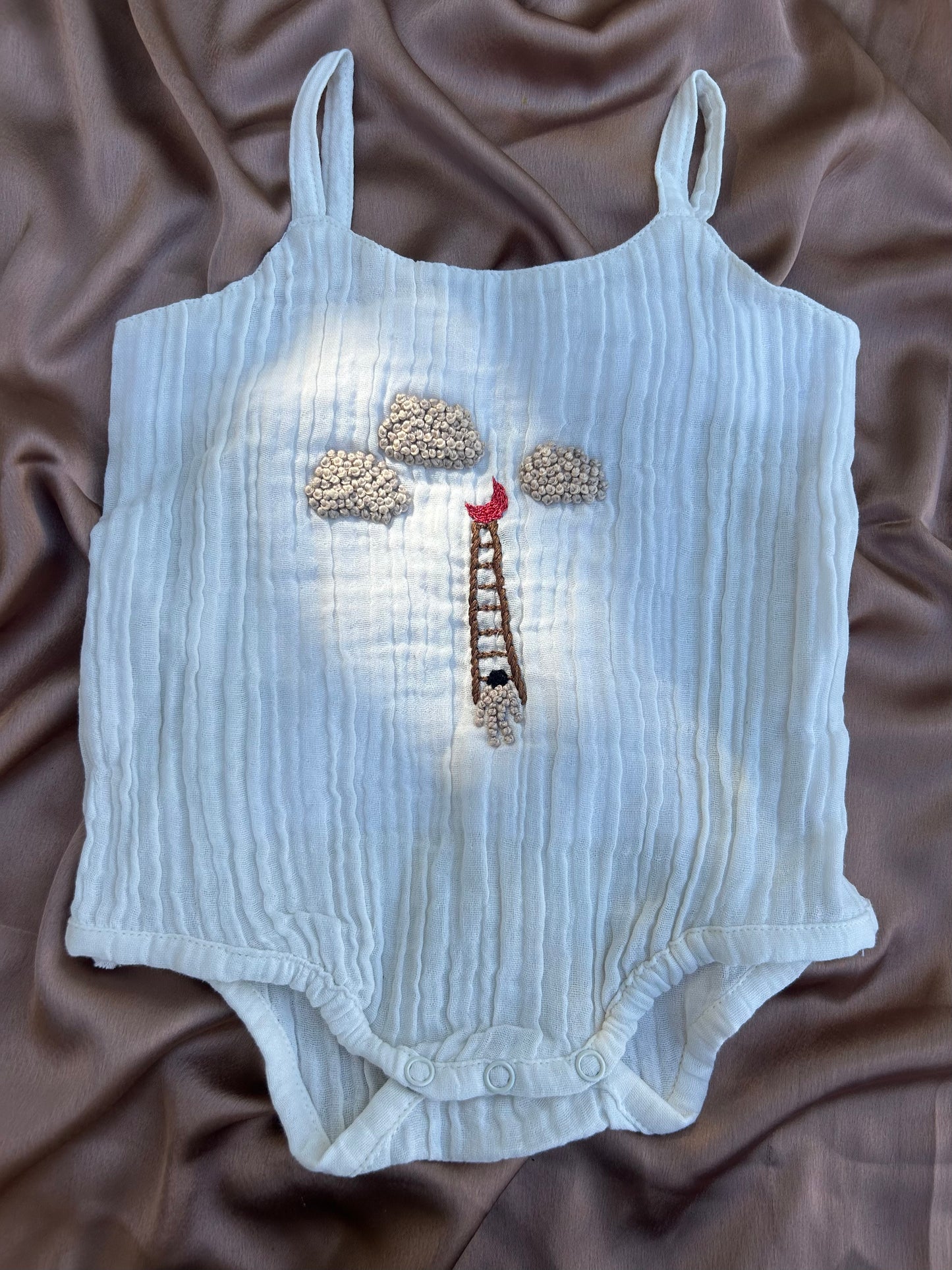 Muslin moonchild onesie